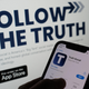 The Truth Social logo displayed on a smartphone and computer screen; used here as stock photo.